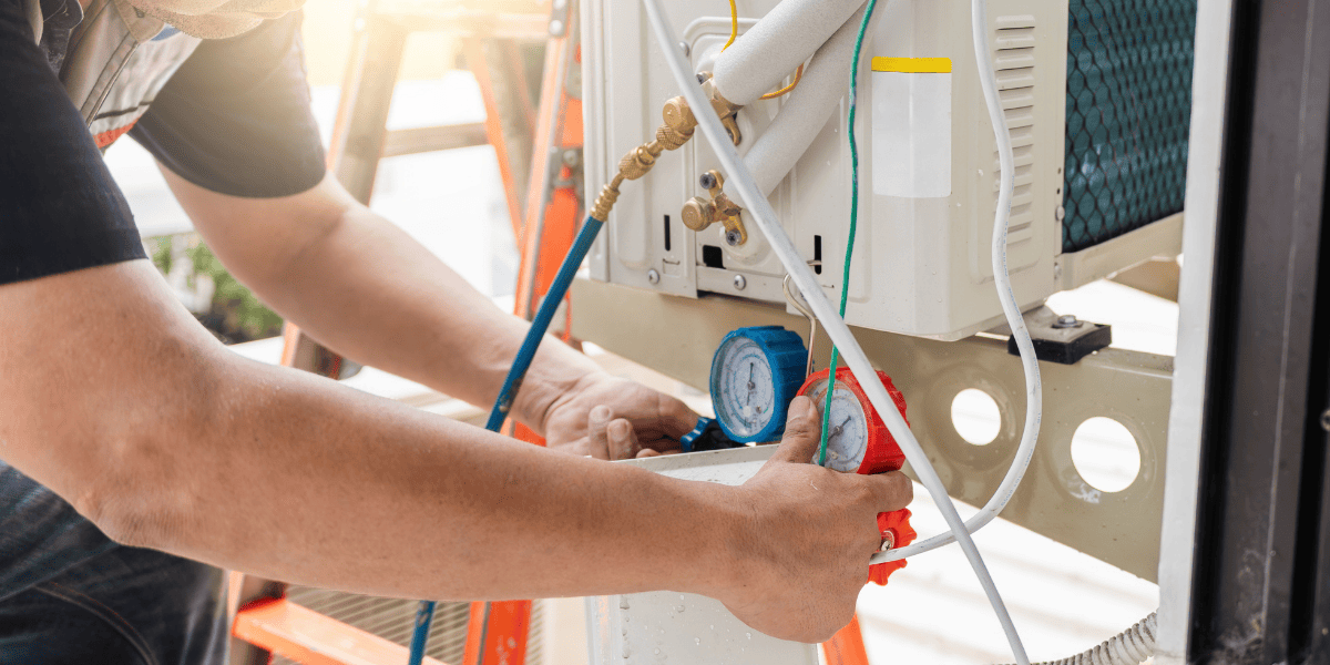 technician doing repairs on an AC unit