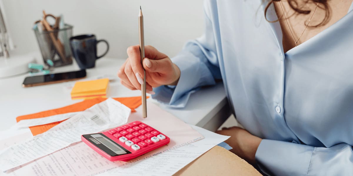 person calculating her energy bills